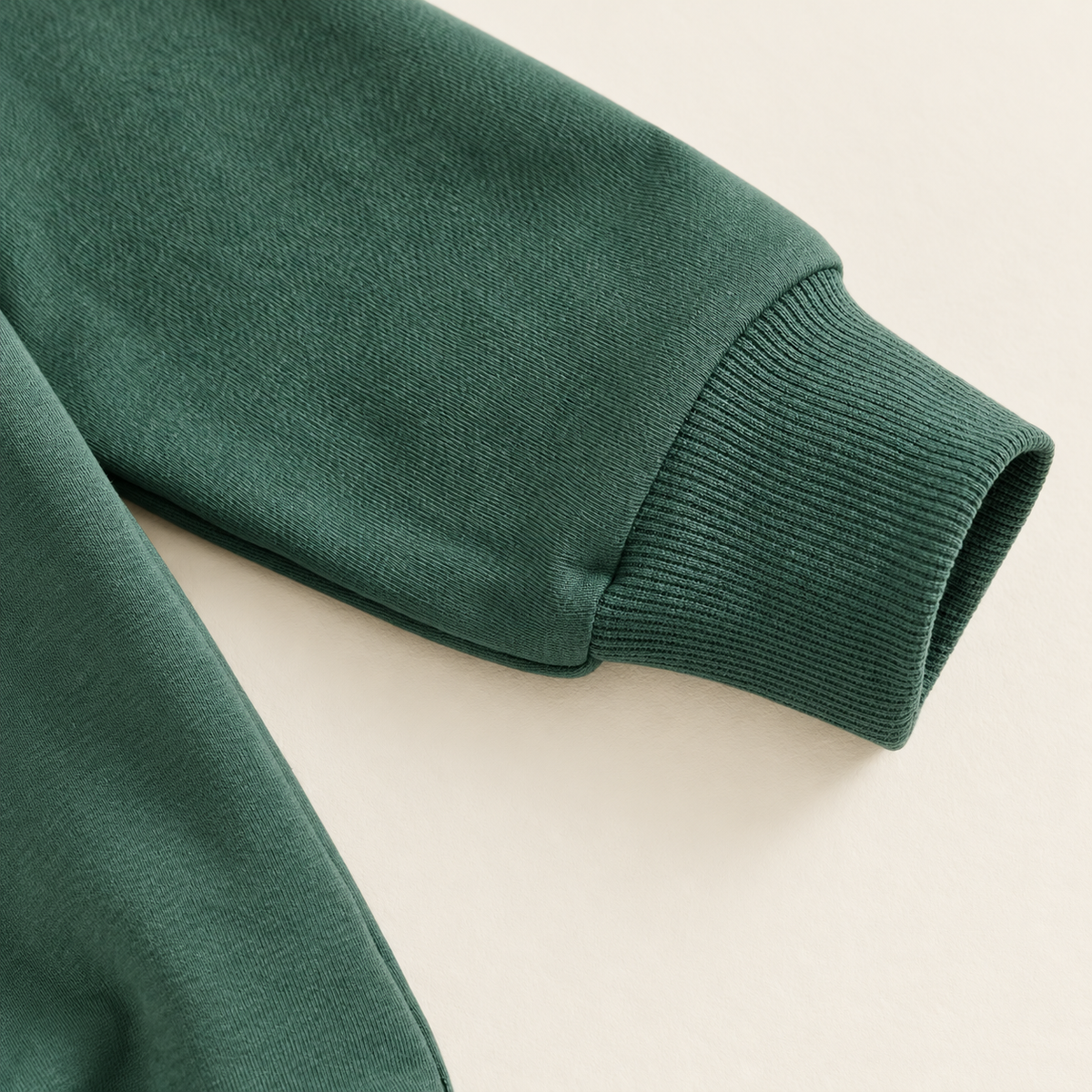 Green ribbed sleeve cuff detail